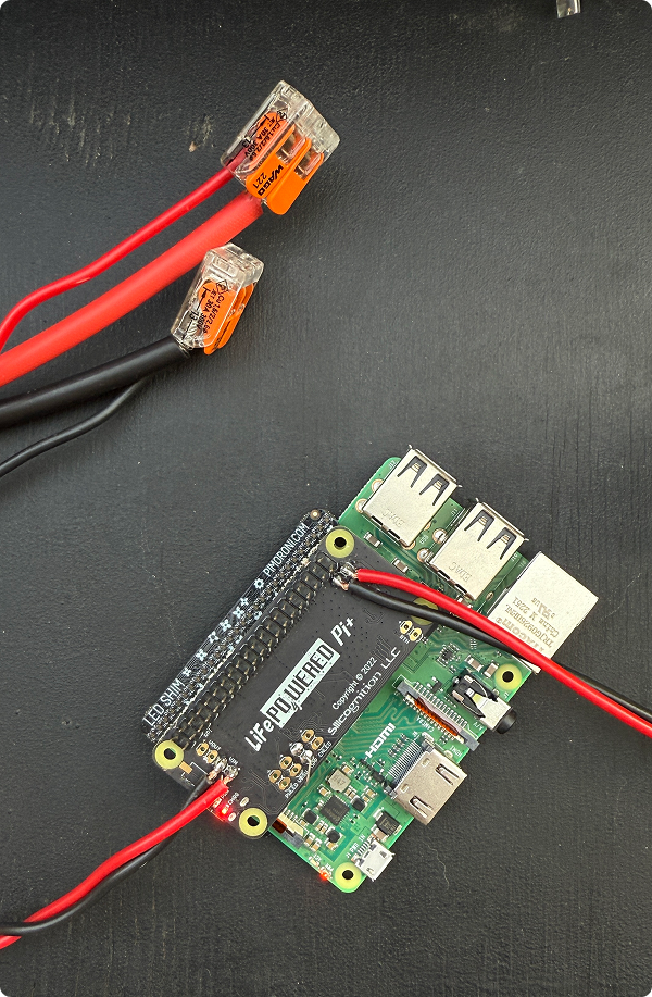 Wiring diagram showing solar panel connections to battery and Raspberry Pi
